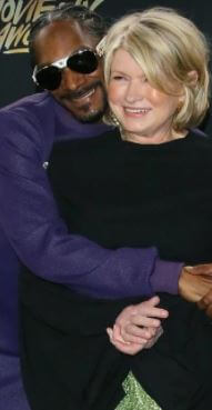 Julian Broadus father Snoop Dogg with Martha in an event.